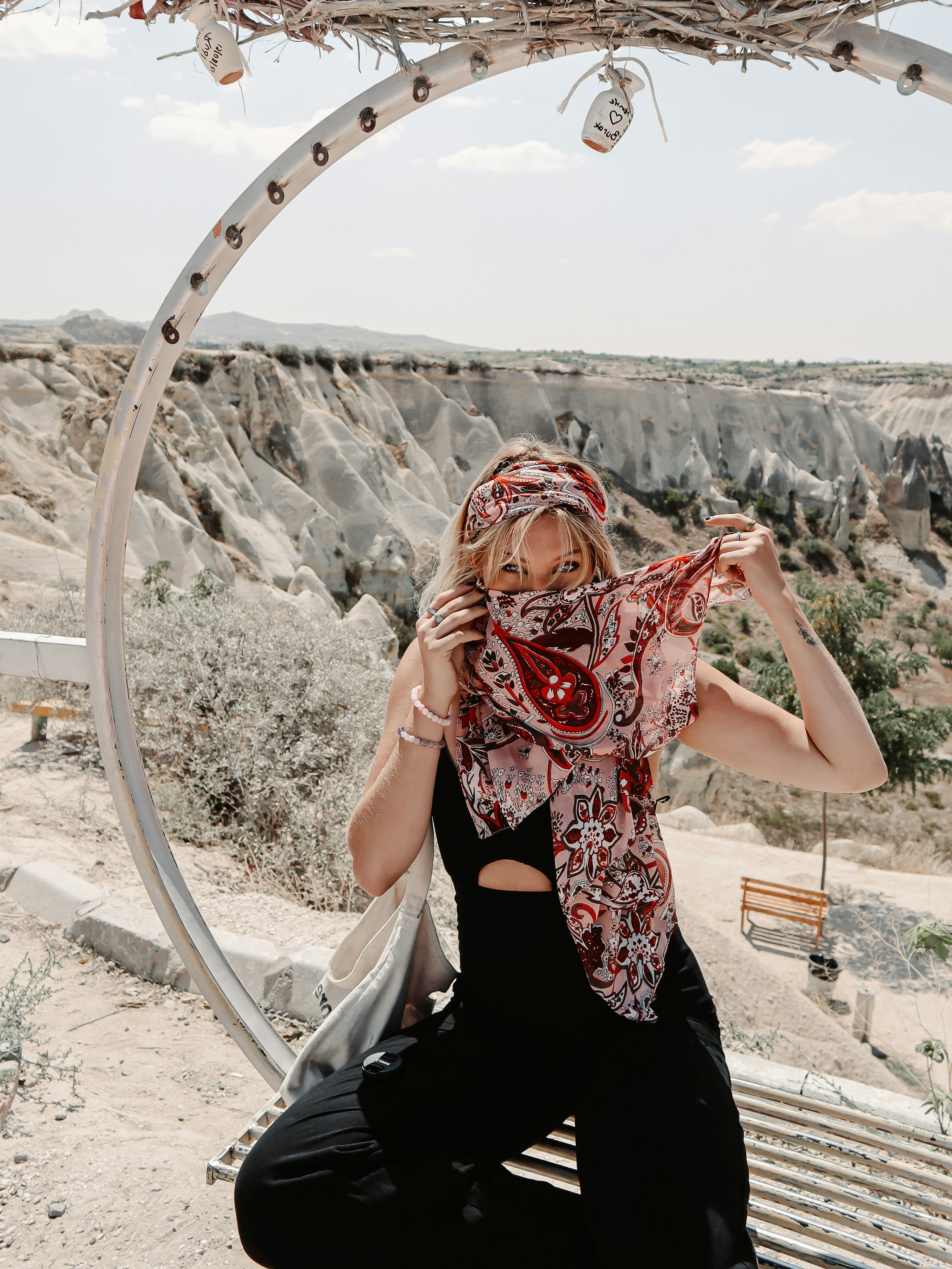 woman in black and red floral sleeveless dress